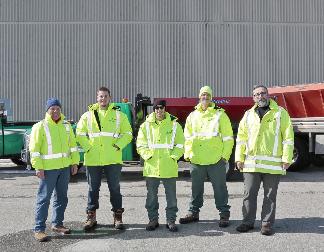 clintar owner and staff in yellow jackets outside